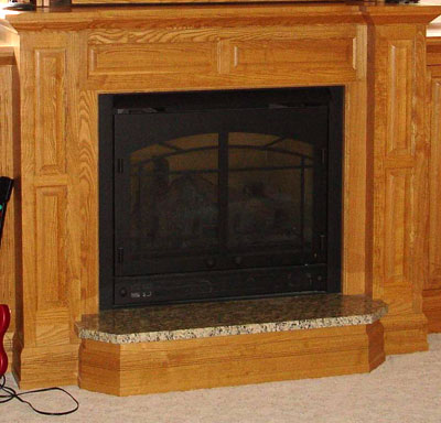 Wood fireplace mantel and hearth